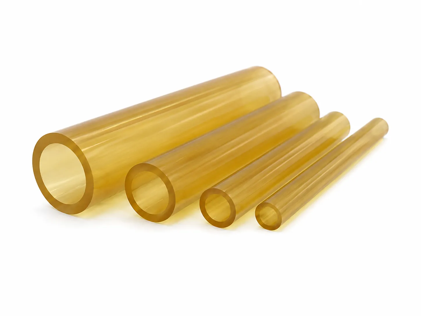 Natural amber PPSU polyphenylsulfone tube stock on a white background